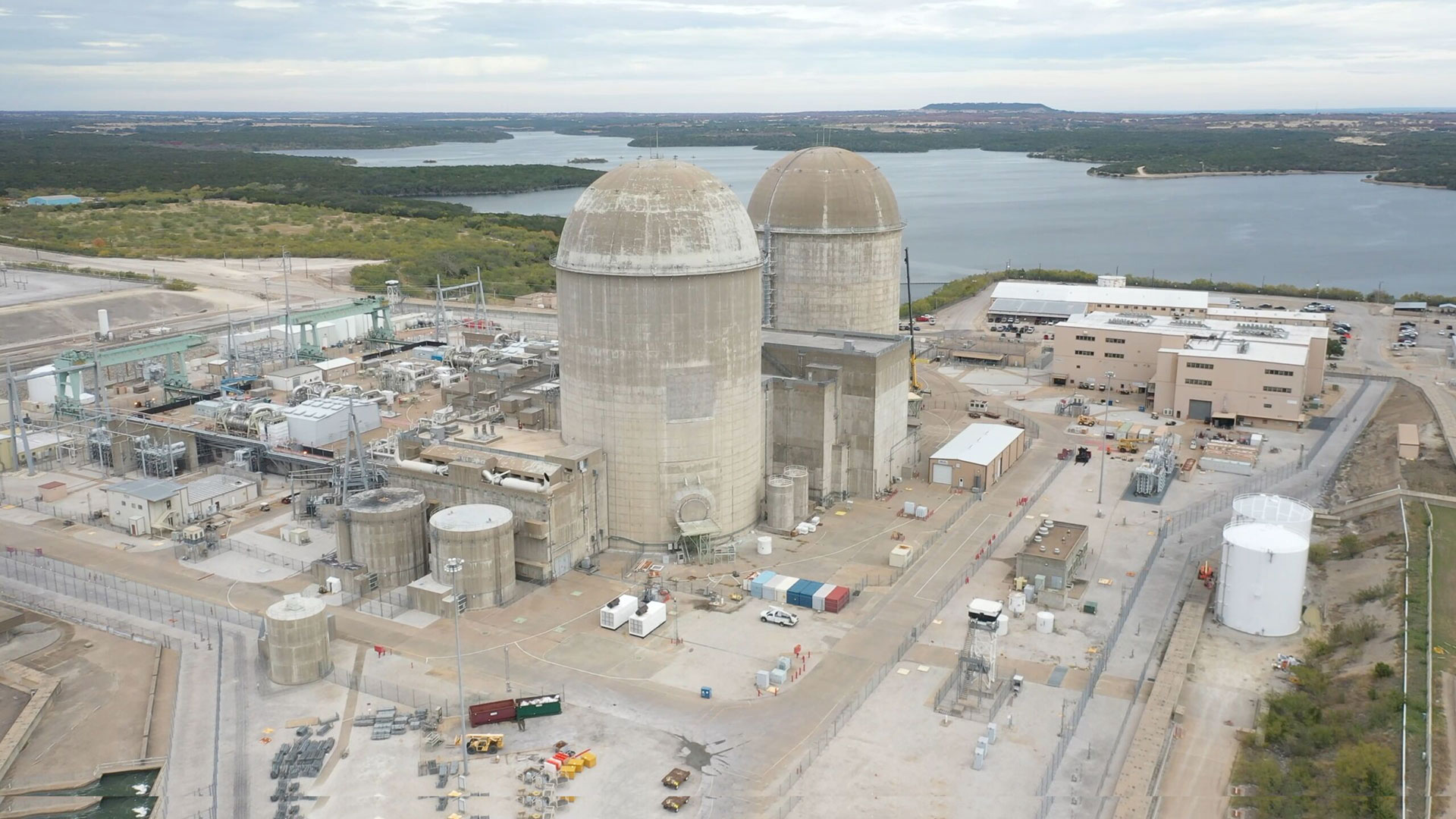 Aerial view of Comanche Peak Nuclear Power Plant in Texas with twin containment domes and surrounding facility infrastructure.